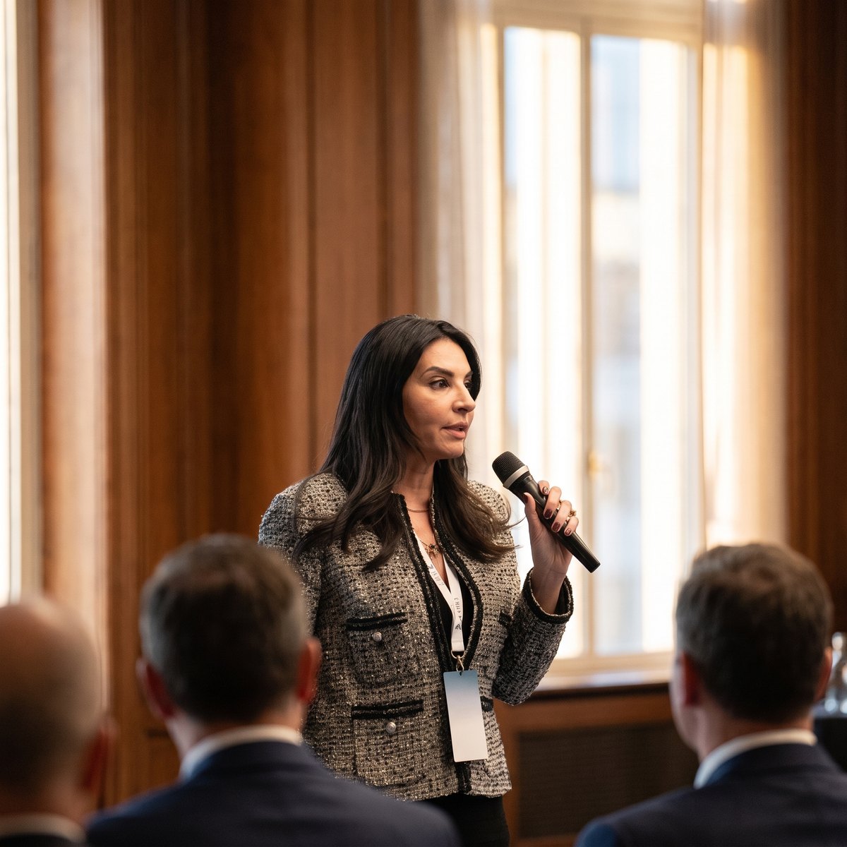 Olga Kiendler speaking to a room of executives